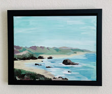Load image into Gallery viewer, Fine art acrylic painting of the Oregon Coat- Abstract Landscape with blue, green, and dark brown beach scene. The painting is framed in a black canvas floater frame, ready to hang.  This photo shows the painting hanging on the wall framed.